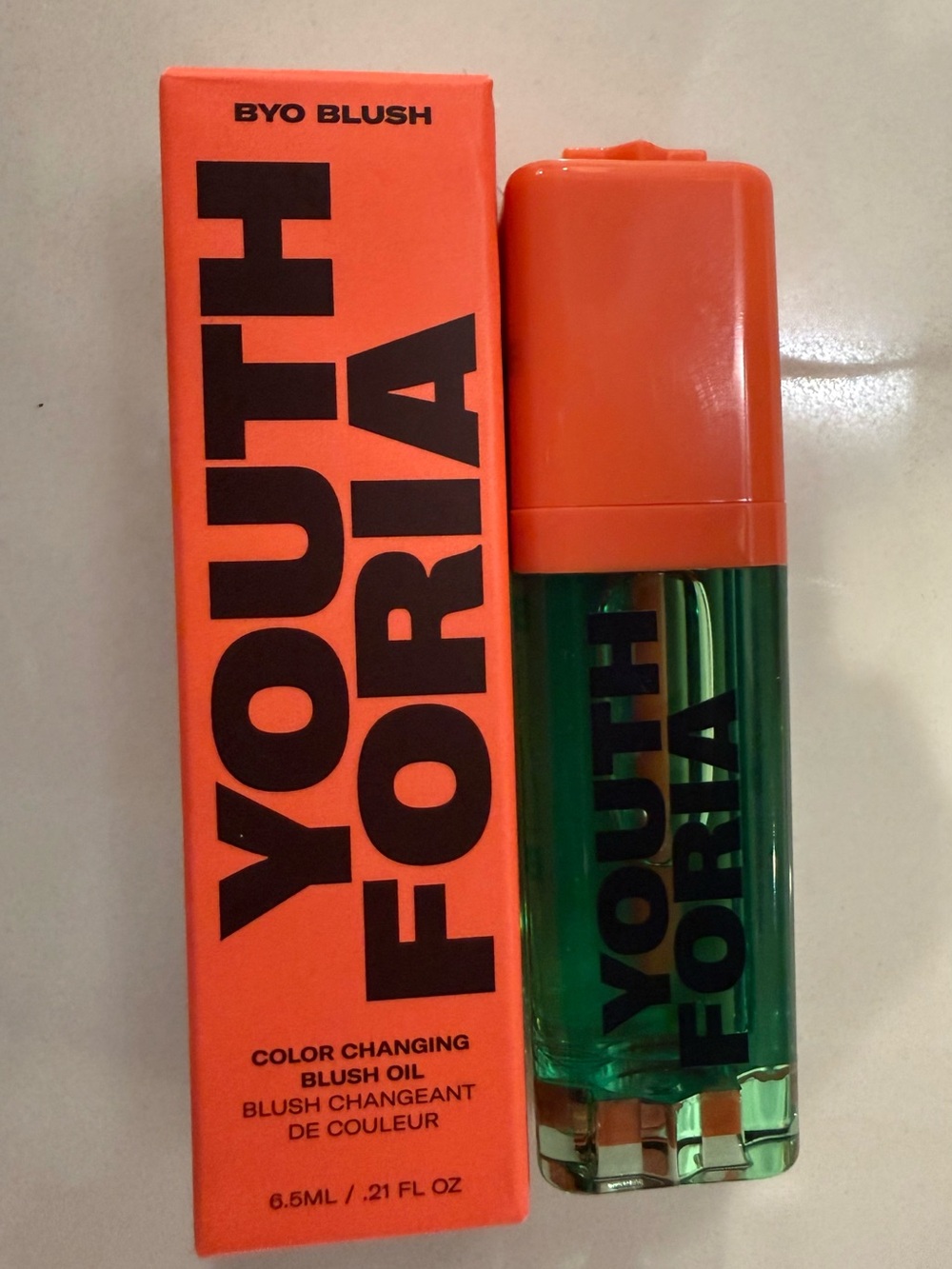 Youth Foria Color Changing Blush Oil — Orange Cap, Green Bottle